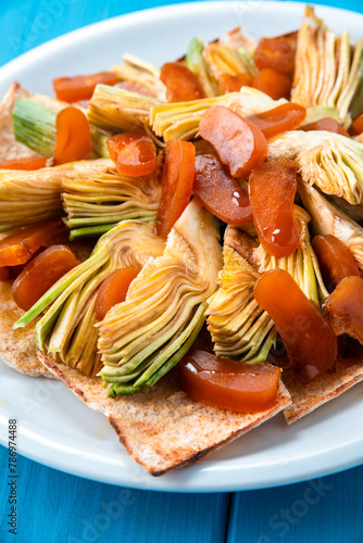 Piatto di carciofi e bottarga di muggine, tipico antipasto della cucina sarda, cibo italiano  photo