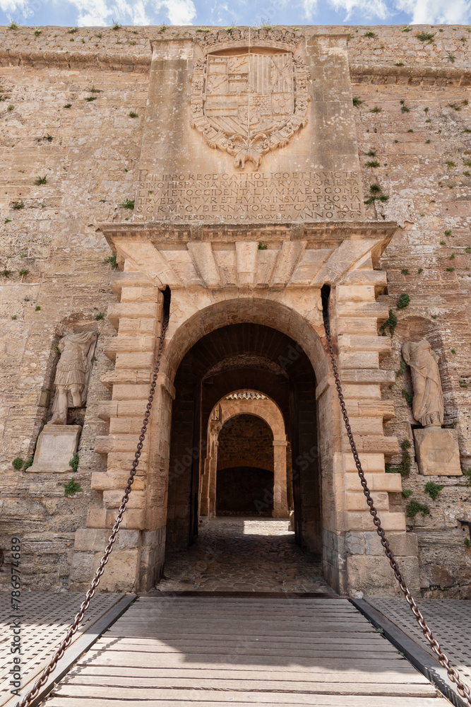 Almudaina Castle entrance in Eivissa, Ibiza, with its drawbridge and heavy chains, stands as a testament to the fortification historical significance and architectural marvel