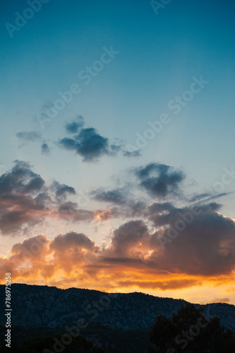 Beautiful nature background with dramatic sundown cloudy sky