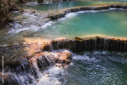 Calm blue water at a waterfall in Laos