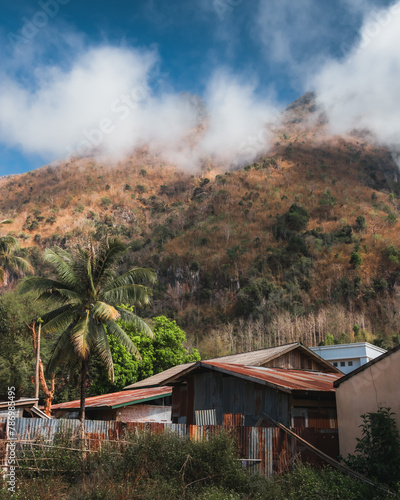 Houses at the base of a mountain in laos