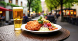 German schnitzel and beer on a table in restaurant