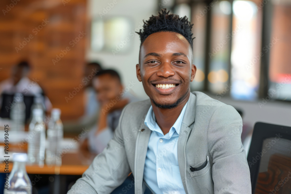 A young African entrepreneur smiles confidently in a professional office boardroom meeting, exuding determination and leadership. A young African entrepreneur smiles confidently in a professional office boardroom meeting, exuding determination and leadership.
