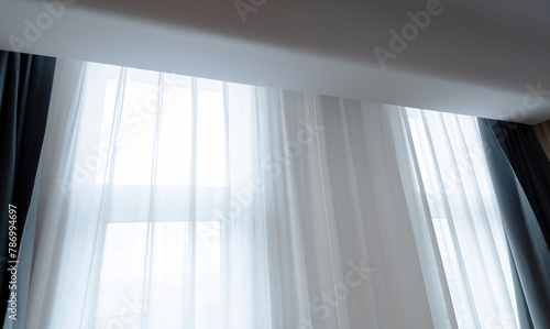 Room window with white curtain © xy