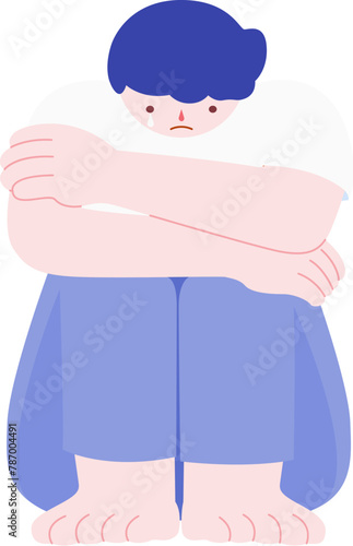 Upset young boy holds himself sitting alone