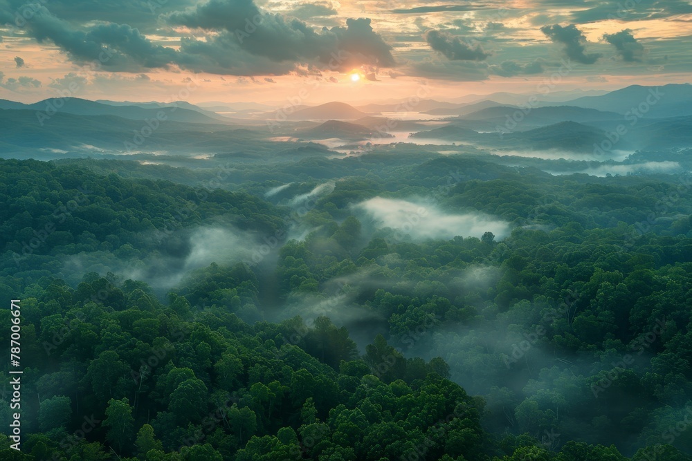 An early morning birds eye view captures misty valleys and rolling hills during a sunrise