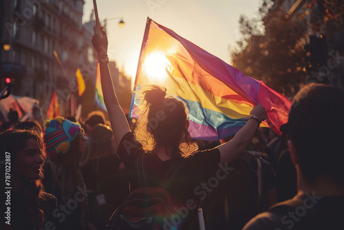 A crowd of people with a flag of the LGBT community in the sun. Concept of equality, freedom, right. Generated by artificial intelligence photo
