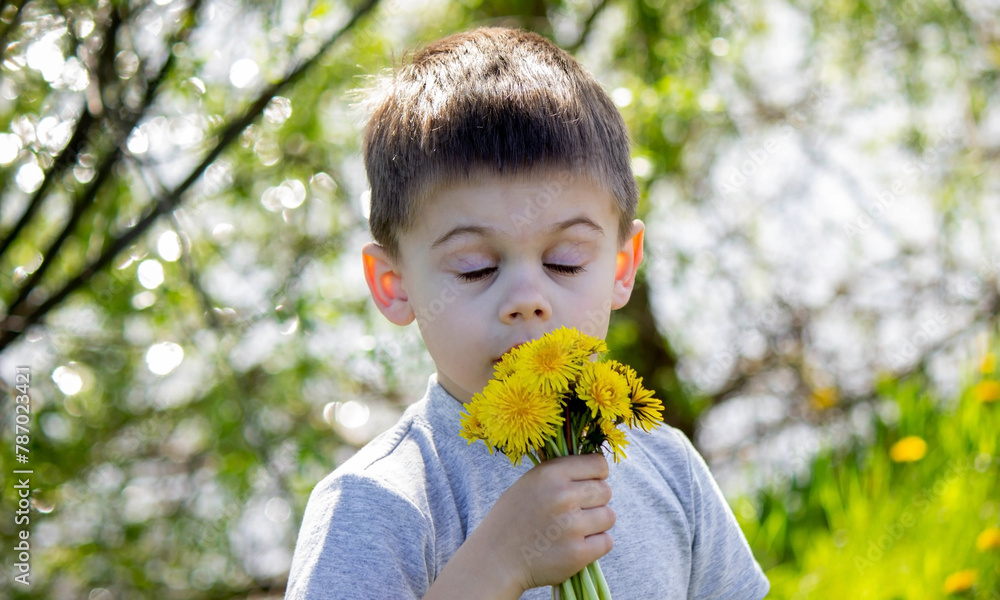 Funny baby sniffs a dandelion. Spring in nature. Allergy to flowering. pollinosis Allergy to pollen. Funny baby sniffs a dandelion. Spring in nature. Allergy to flowering. pollinosis Allergy to pollen.