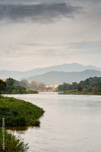 Vertical of river banks with wooden boats in Kuala Kangsar, Malaysia