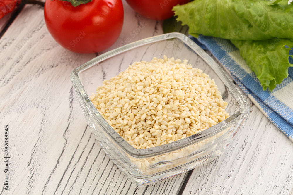 Raw sesame seeds in the bowl Raw sesame seeds in the bowl