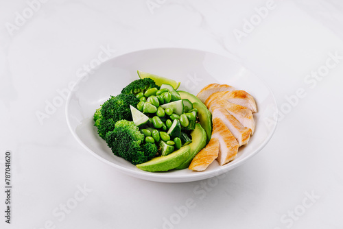 Healthy grilled chicken and green vegetables plate