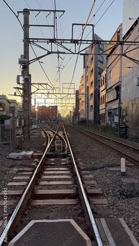 Sunset at a Japanese railway crossing