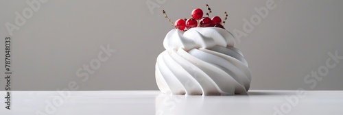 Pavlov's cake. Cake with perfect whipped cream swirls and some small details of red berries on top, very luxurious, with light gray background. Banner © Denis