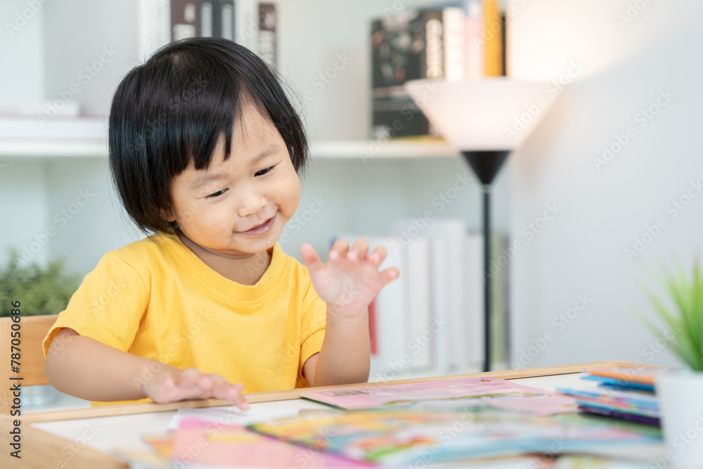 Happy Asian children relax read book at home. daughter and reading a story. learn development, childcare, laughing, education, storytelling, practice, imagine, reduce addiction mobile phone Happy Asian children relax read book at home. daughter and reading a story. learn development, childcare, laughing, education, storytelling, practice, imagine, reduce addiction mobile phone