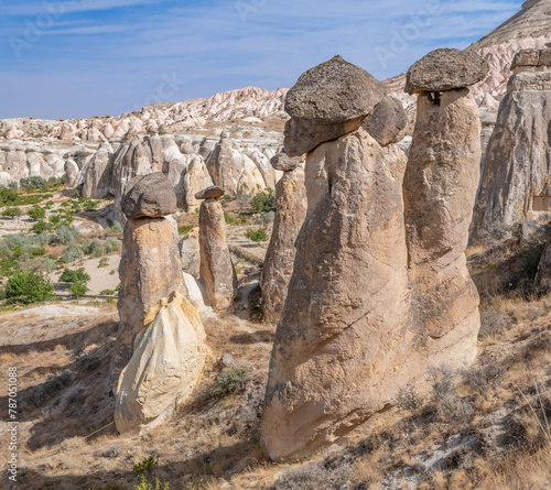 Fairy chimneys, unique rock formations near Cavusin Town in Cappadocia, Turkey..
