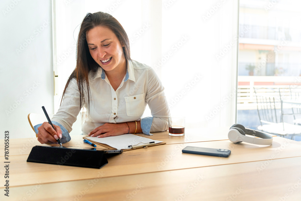 Middle aged business woman working at home Middle aged business woman working at home