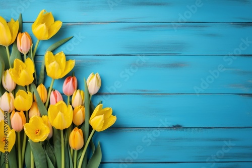 Yellow tulips on blue wooden background. Generative AI