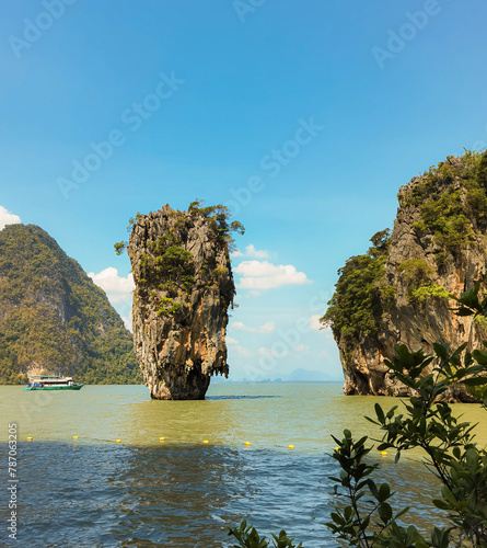 Kayaking on emerald waters in Thailand near the famous James Bond rock. 