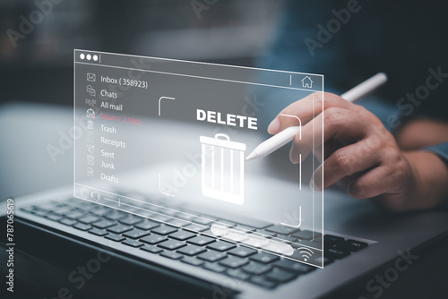 The programmer's hand is tapping on the file icon under the concept of data deletion. The concept  technology and document management.data deletion and removal