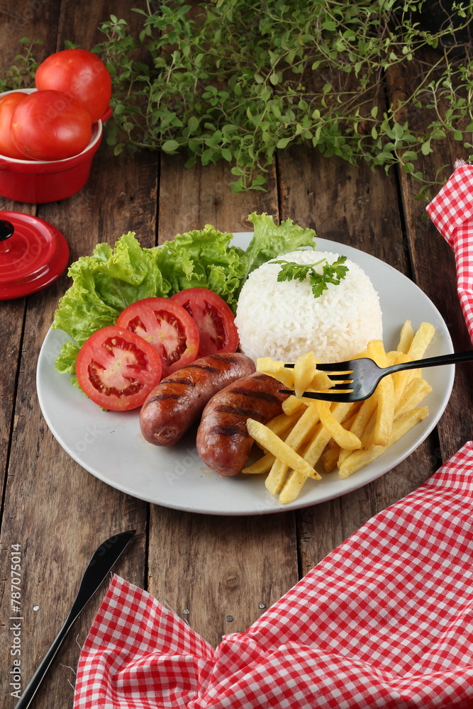 sausage, french fries and salad
