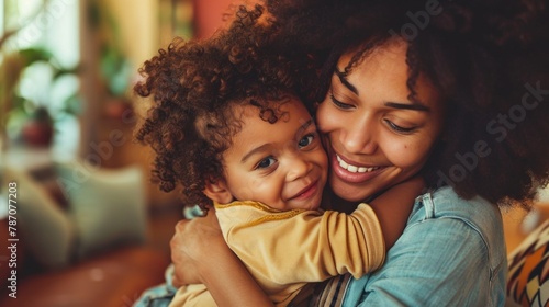 Affectionate loving middle aged mother cuddling child. Excited to see daughter, happy senior older mom cuddling her, sitting together on comfortable sofa in living room