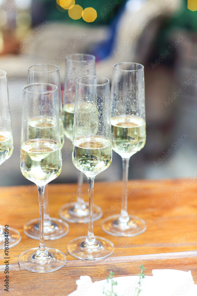 Glasses of sparkling wine on wooden table on Christmas Glasses of sparkling wine on wooden table on Christmas