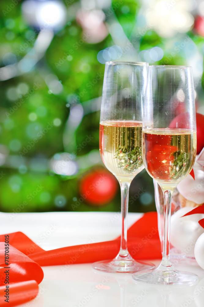 Glasses of champagne and Christmas decorations Glasses of champagne and Christmas decorations