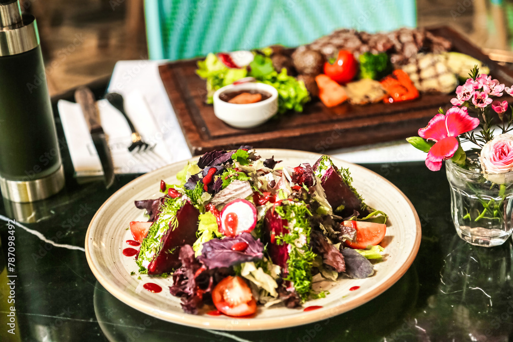 Fresh Salad and Glass of Water on Table Fresh Salad and Glass of Water on Table