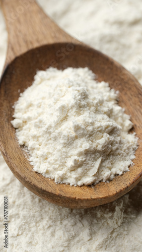 Flour for bakery in wooden spoon 