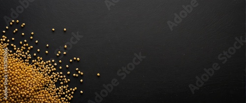 Mustard seeds (black) on a black background. photo