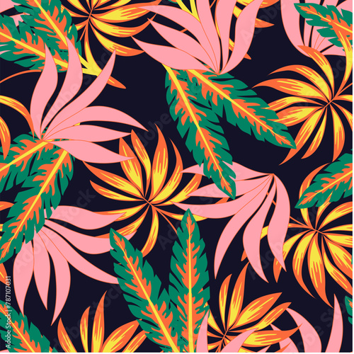 Abstract seamless tropical pattern with bright plants and leaves on a black background. Tropical botanical. Exotic jungle wallpaper.Colorful stylish floral. 