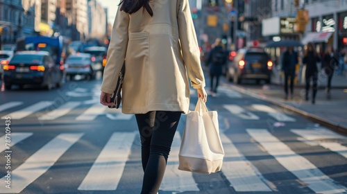 Trendy tote bag held by a fashion-forward individual crossing the street, showcasing everyday functionality and style