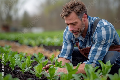 A focused individual carefully planting in fertile soil, surrounded by young sprouting plants ready for growth