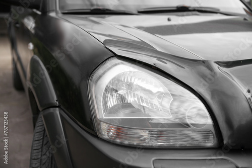 headlight of a black car, beautiful headlight close-up

