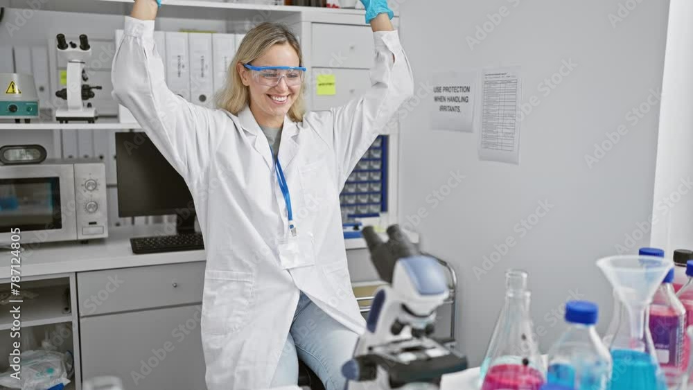 A joyful woman scientist celebrating a discovery in a laboratory filled with colorful chemical flasks and a microscope. A joyful woman scientist celebrating a discovery in a laboratory filled with colorful chemical flasks and a microscope.