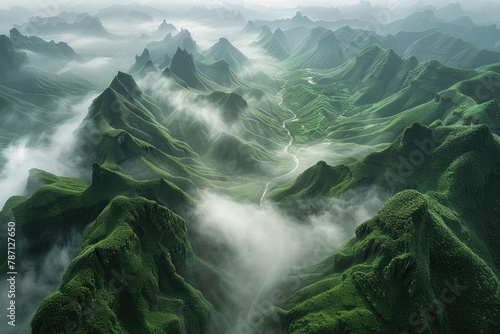 aerial view of beautiful green mountains covered with natural white fog in the morning in a cloudy day