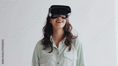 a photo of a woman standing, relaxed smile, with light green shirt, wearing virtual reality glasses