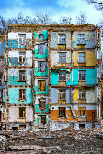 Wall of a destroyed house. Collapse of a multi-story building due to an earthquake, military action, or economic crisis. Old house uninhabitable.Relocation from dilapidated and emergency housing. © Евгений Панов