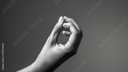 Black and white toned background with black and white dhyana mudra. Yogic hand gesture. photo