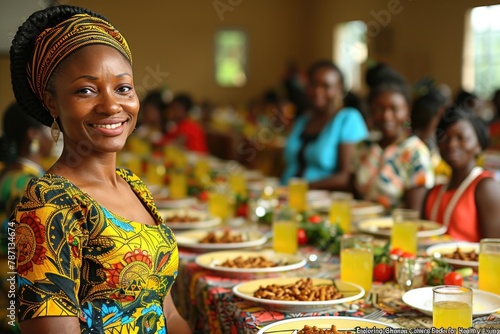 African woman wearing traditional headwrap at food market.