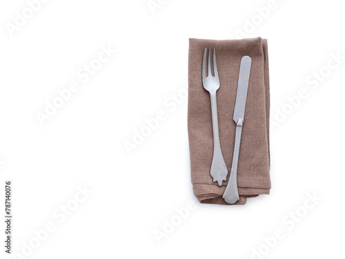 Overhead shot of a brown linen kitchen napkin isolated on white background. Folded cloth for mockup