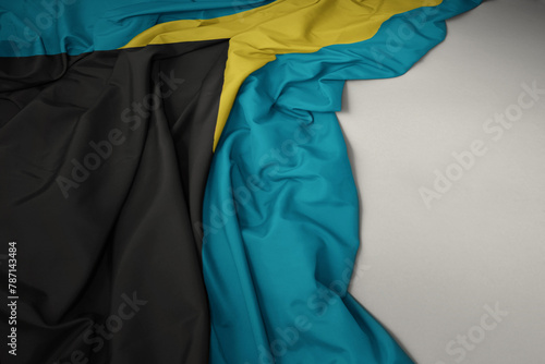 waving national flag of bahamas on a gray background.
