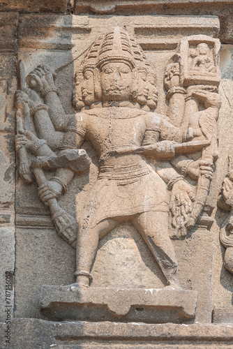 Sculptures or carvings of Ramayana on the outer wall of Lord Vishnu temple. Located in the backwater of Ujjani Dam, Palasdev, Indapur, Maharashtra, India. photo