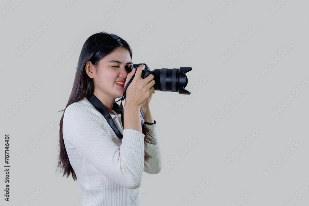 smiling Woman photographer is taking images photo with camera isolated on white background. smiling Woman photographer is taking images photo with camera isolated on white background.