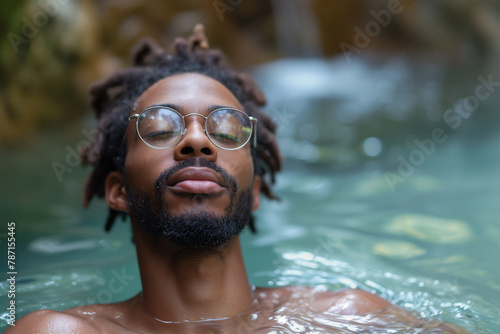 Tranquil man relaxing in the water with glasses Generative AI image © ADDICTIVE STOCK CORE