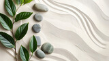 Zen garden stones and green leaves on white sand with