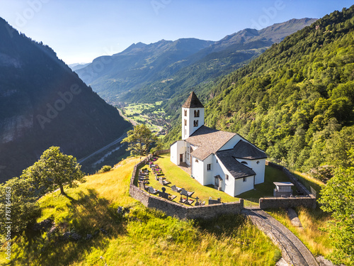 Aerial view of San Martino Church in Calonico during summer day, Leventina, Switzerland