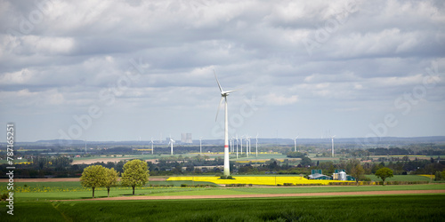 Ense, NRW, Germany, 04 15 2024, wind par, several wind generators, Cooling towers of a power plant in the background photo