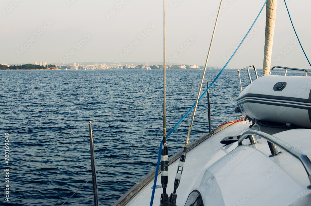 Sailboat approaching Zadar marina yacht harbor in Croatia, Europe in the evening light Sailboat approaching Zadar marina yacht harbor in Croatia, Europe in the evening light