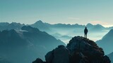 A person standing on a mountaintop, overlooking a vast landscape, symbolizing the sense of accomplishment and financial independence that comes with achieving longterm financial goals